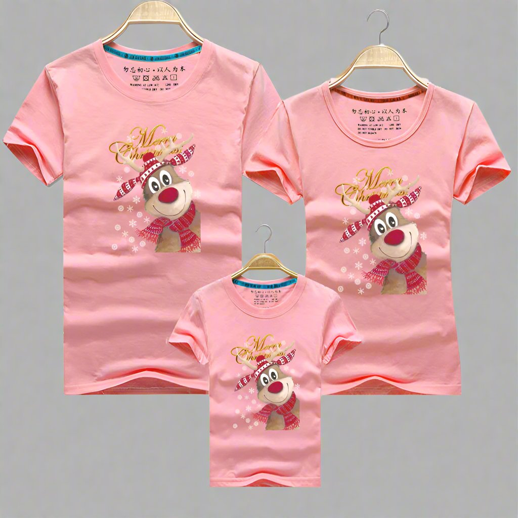 Pink family Christmas shirts featuring a reindeer with a scarf and cheerful holiday design