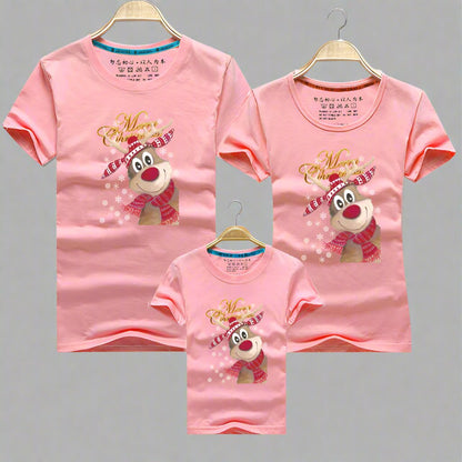 Pink family Christmas shirts featuring a reindeer with a scarf and cheerful holiday design