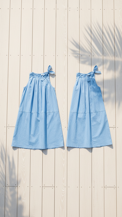 Elegante vestido azul sin mangas con detalle de lazo | DLM