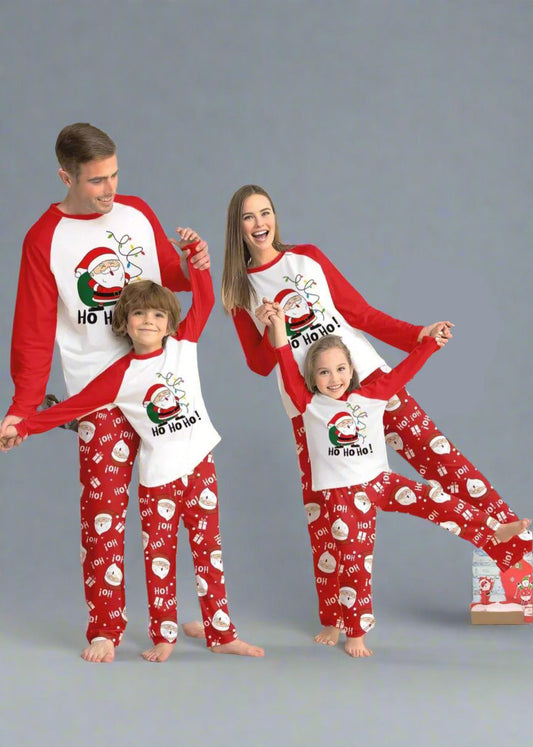 Festive family pajamas with Santa Claus 'Ho Ho Ho' design and holiday-themed red pants