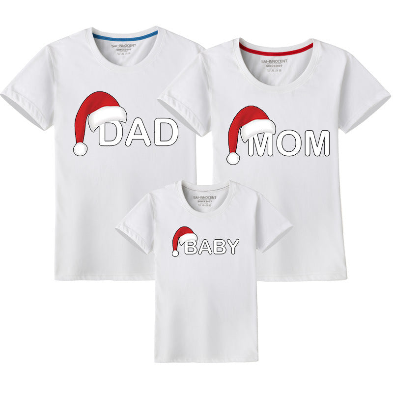 White family Christmas matching shirts featuring Santa hat design with 'Dad,' 'Mom,' and 'Baby' lettering