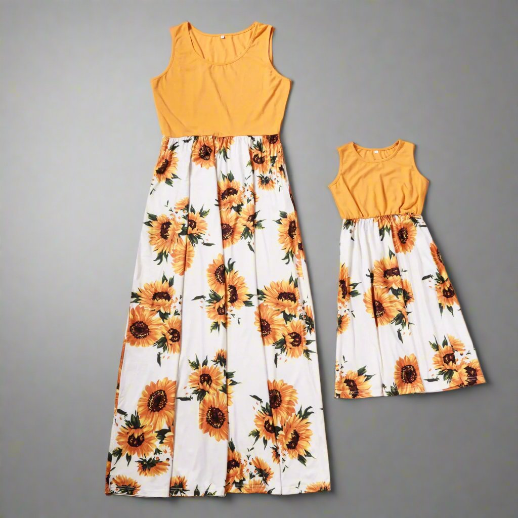 Mommy and daughter wearing matching sunflower print dresses for a day out