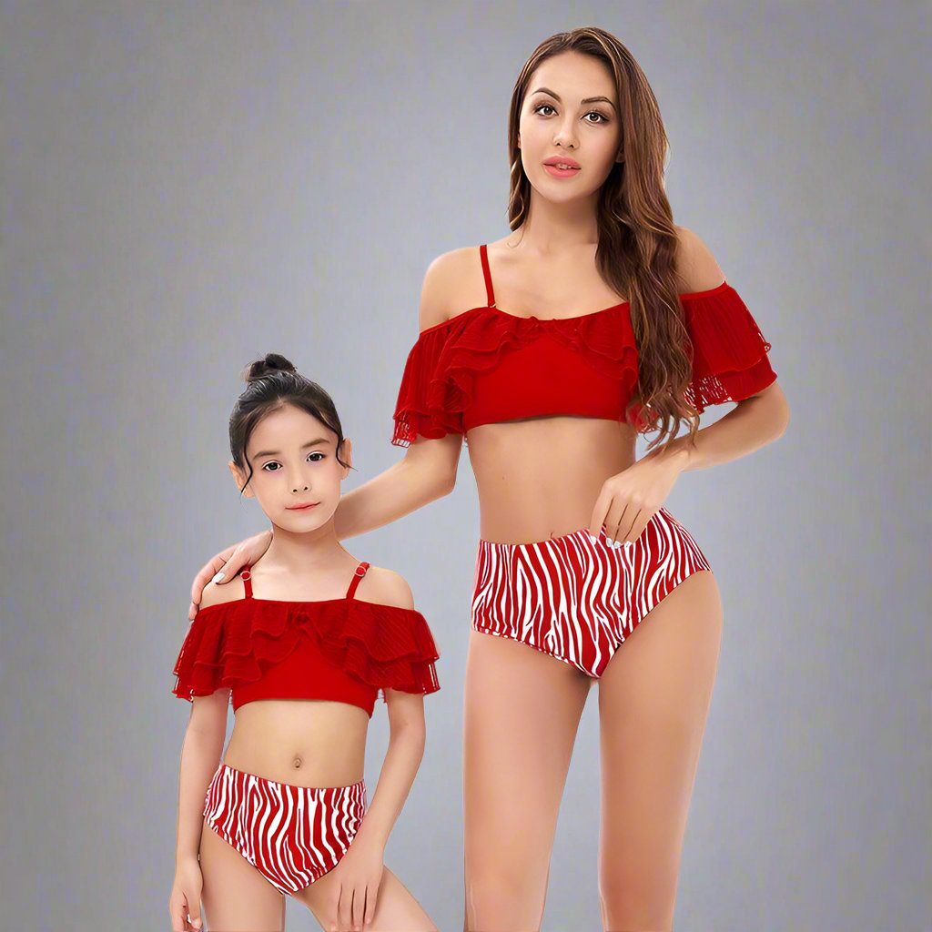 Close product view of mommy and me swimsuits with christmas print