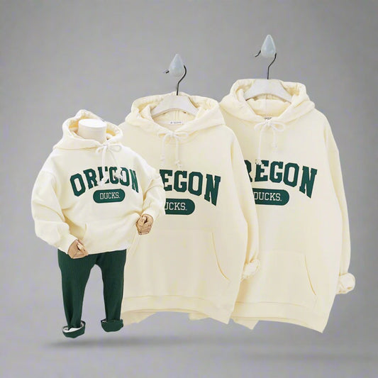 Matching purple hoodies for the whole family with Oregon print, perfect for cozy family outings